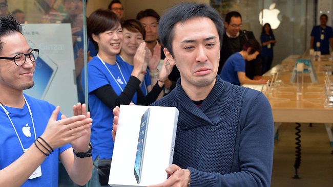 Takaaki Sasaki cries tears of joy in Tokyo holding new iPad Air