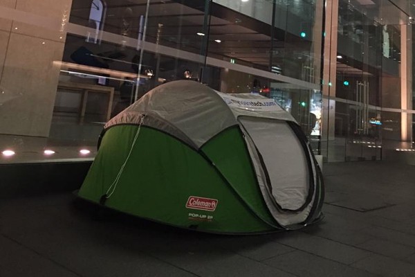 Apple fan has already set up tent in front of the Apple Store in Sydney