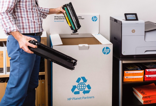 Business Man Recycling in HP Planet Partners Recycle Box